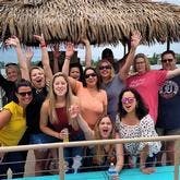 Family group on boat waving